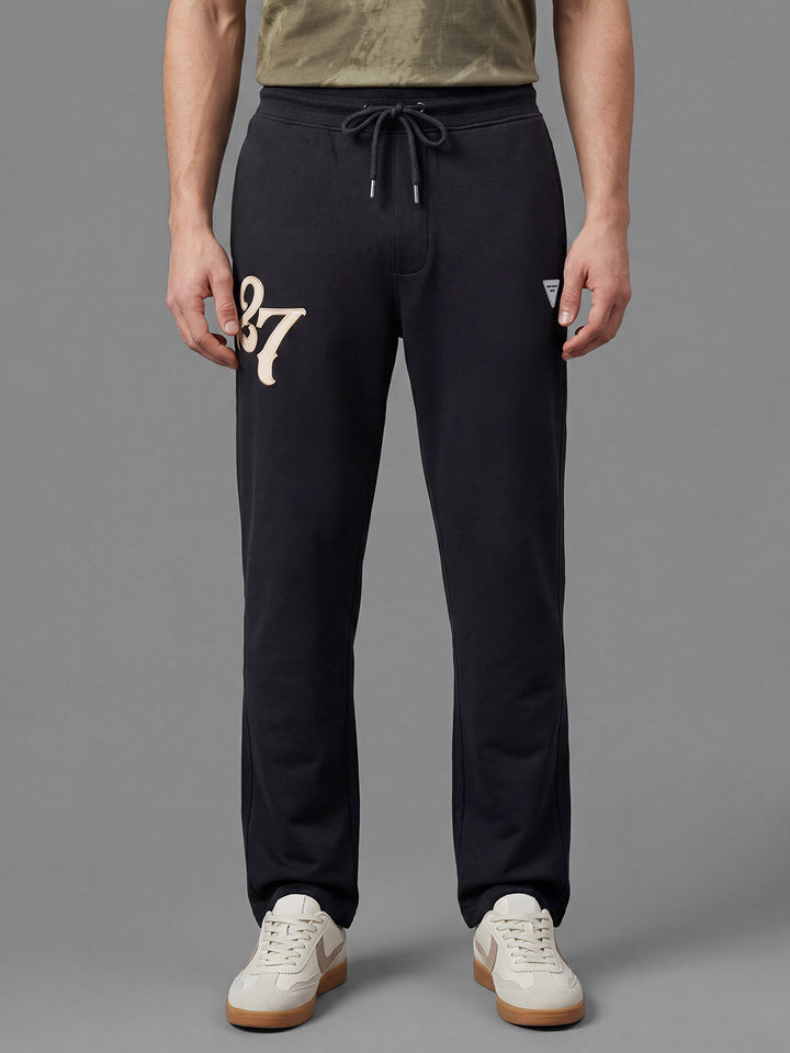 Black Loose Regular Fit Graphic Print Pure Cotton Mid Rise Men's Track Pants by Being Human Clothing