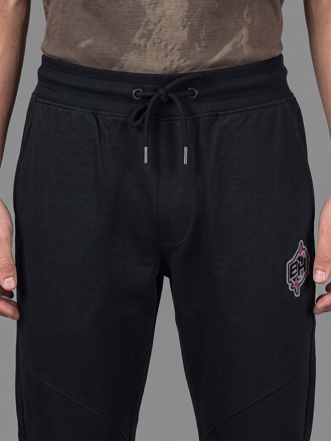 Black Loose Regular Fit Solid Cotton Blend Mid Rise Men's Track Pants by Being Human Clothing