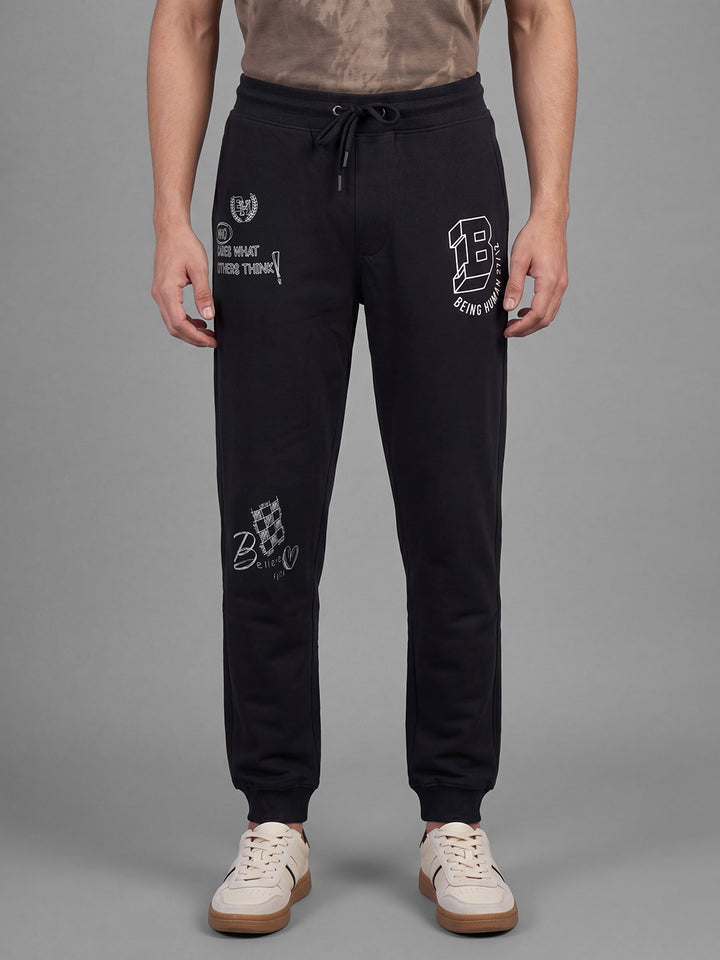 Black Loose Regular Fit Graphic Print Pure Cotton Mid Rise Men's Track Pants by Being Human Clothing