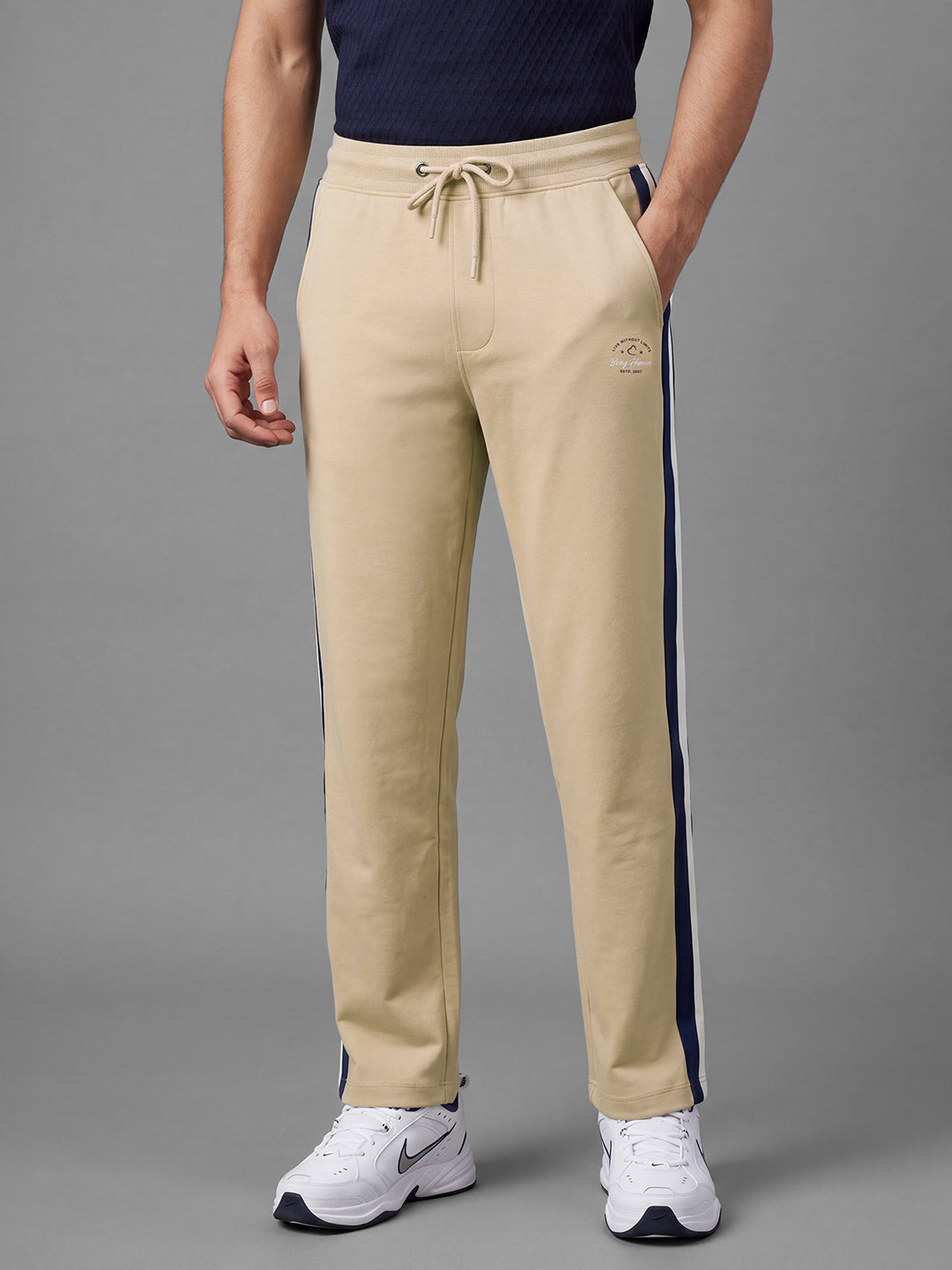 Beige Loose Regular Fit Colorblock Cotton Blend Mid Rise Men's Track Pants by Being Human Clothing