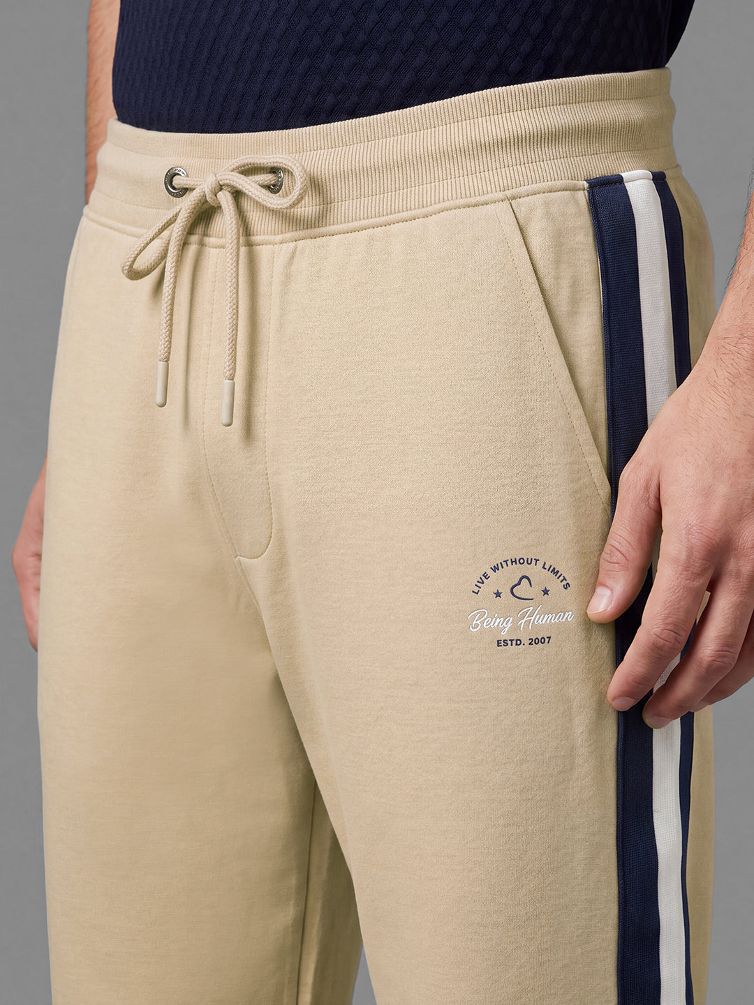 Beige Loose Regular Fit Colorblock Cotton Blend Mid Rise Men's Track Pants by Being Human Clothing